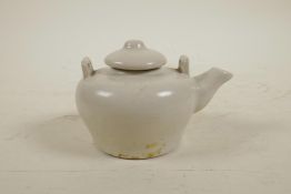 A Chinese cream glazed porcelain teapot, 3½" diameter