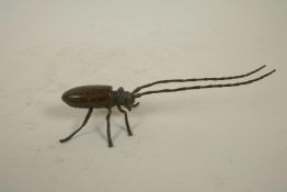 A Japanese Jizai style bronzed metal beetle with articulated limbs and antennae, 5½" long