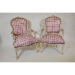 A pair of Louis style armchairs with Gingham upholstery and distressed paint finish
