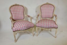 A pair of Louis style armchairs with Gingham upholstery and distressed paint finish