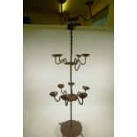 A wrought iron fifteen branch standing candlestick with twisted stem, A/F, 45" high