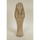 An Egyptian terracotta shabti, 15" high