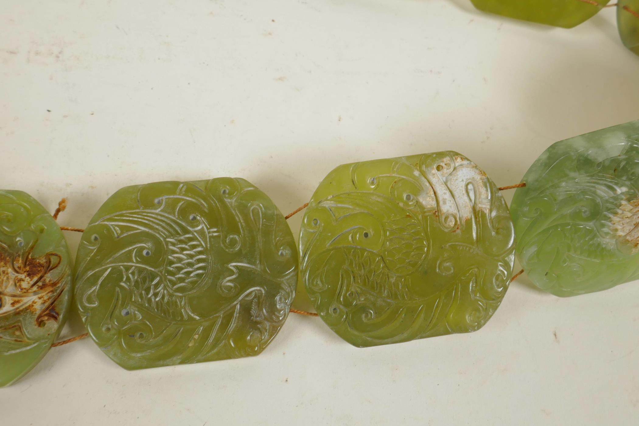 A Chinese green jade belt, with carved decoration to each panel depicting a phoenix, 40" long - Image 2 of 4