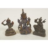 Three miniature Sino-Tibetan bronze figures of Buddhistic deities, largest 3" high