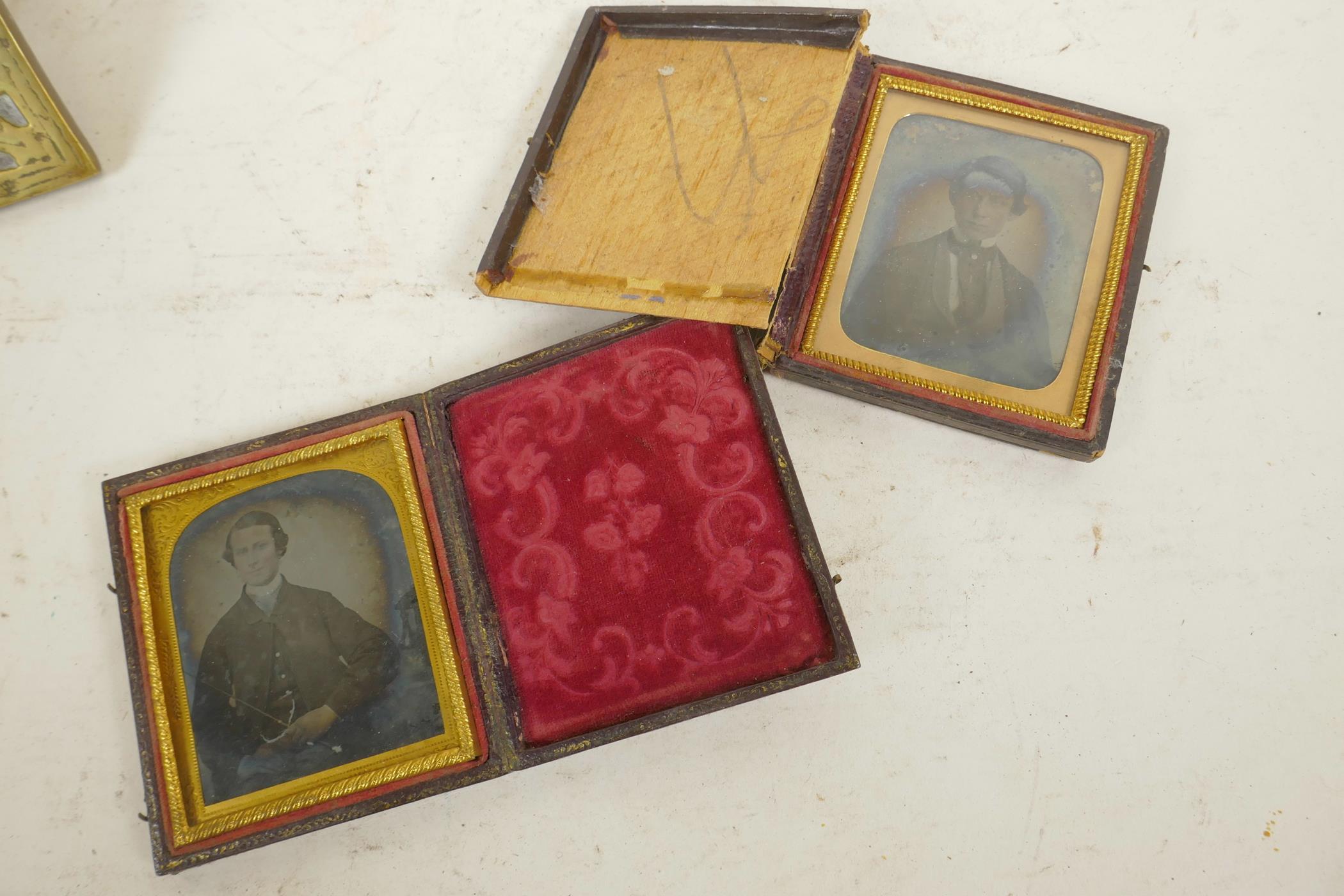 Two cased daguerreotype photographic portraits of gentlemen, one case A/F, 3¾" x 4¾"