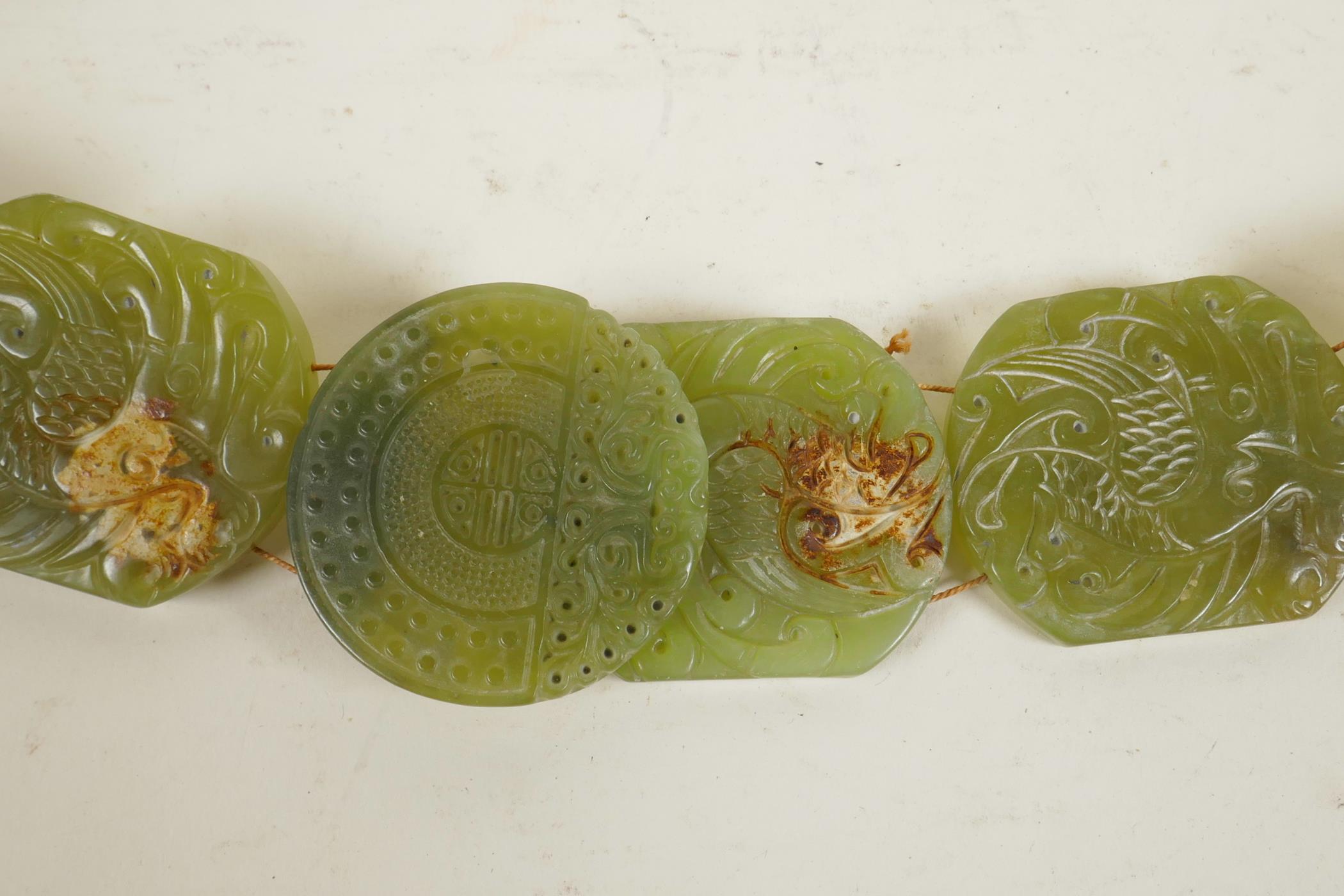 A Chinese green jade belt, with carved decoration to each panel depicting a phoenix, 40" long - Image 3 of 4