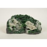 A Chinese green and white mottled hardstone ornament carved in the form of a mountain village
