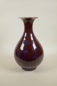 A Chinese flambe glazed pear shaped vase, 13½" high