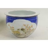 A Chinese blue and white bulbous jar with four angry face mask handles and decorated with birds