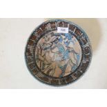 A Middle Eastern terracotta bowl decorated with stylised Islamic text, and huntsman with hawk and