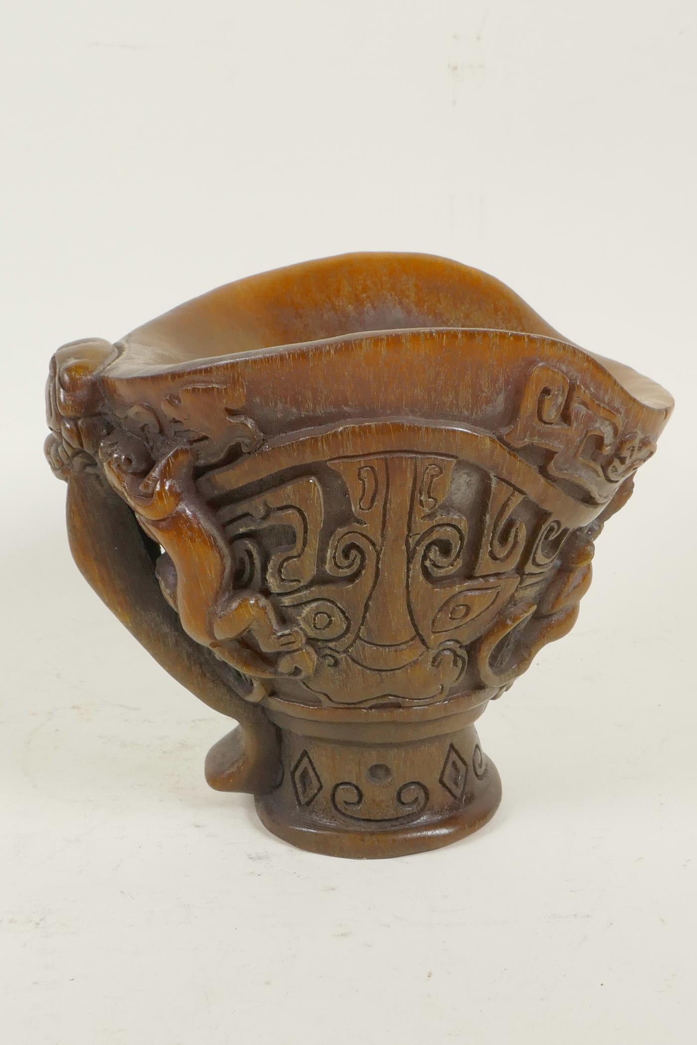 A Chinese faux horn libation cup decorated with archaic symbols and exotic beasts, 5" high - Image 3 of 4