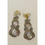 A pair of silver gilt drop earrings set with uncut diamonds, 1½" drop