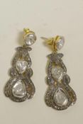 A pair of silver gilt drop earrings set with uncut diamonds, 1½" drop