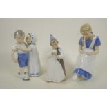 A Royal Copenhagen porcelain figure of a small boy with large umbrella marked NVX 1145, 6¼" high,