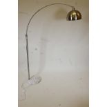 A contemporary brushed steel floor lamp with a white marble base, 70" high