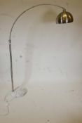 A contemporary brushed steel floor lamp with a white marble base, 70" high