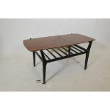 A mid century coffee table on black lacquered legs with a slatted undertier, 35½" x 17½", 17½" high