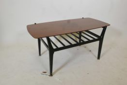 A mid century coffee table on black lacquered legs with a slatted undertier, 35½" x 17½", 17½" high