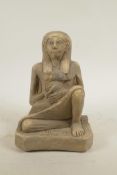 An Egyptian terracotta figure of a mother and child, 9" high