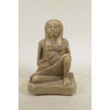 An Egyptian terracotta figure of a mother and child, 9" high