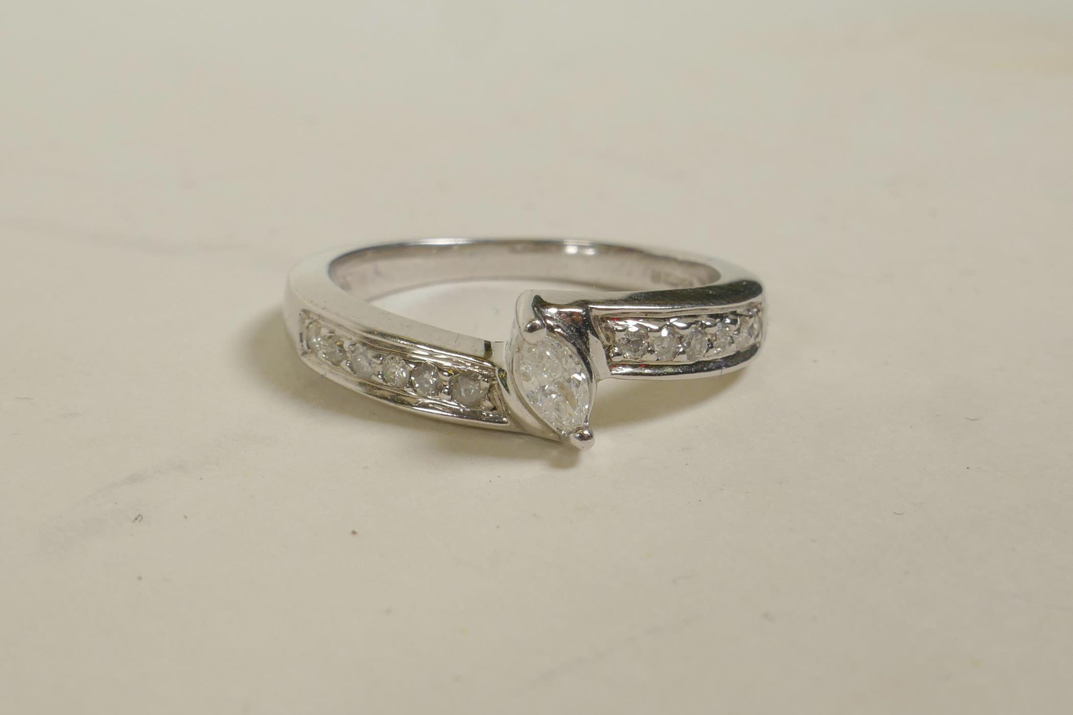 A 9ct white gold diamond dress ring, approximate size 'M/N'