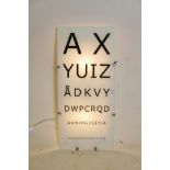 An optician's illuminated glass board, 10¼" x 22"