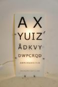 An optician's illuminated glass board, 10¼" x 22"