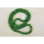 A string of jade beads, 33" long
