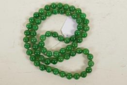 A string of jade beads, 33" long