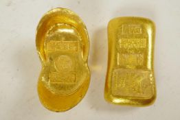 Two Chinese gilt metal ingot weights impressed with calligraphy, 2¼"