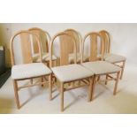 A set of six Italian contemporary ash dining chairs, with hoop backs