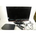 An LG26LG4000 26" television with built in DVD player on swivel pedestal base together with a Sky