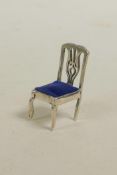 A 925 silver pin cushion in the form of a chair, 1½" high