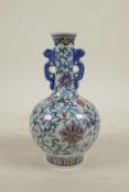 A Chinese doucai red and white porcelain vase with scrolling floral decoration, 6 character mark