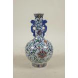 A Chinese doucai red and white porcelain vase with scrolling floral decoration, 6 character mark