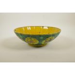 A Chinese Sancai glazed porcelain bowl of lobed lotus flower form decorated with cranes, character