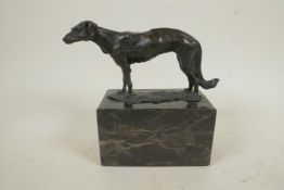 A bronze figure of a Borzoi hound mounted on a marble plinth, 6¼" long