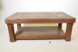 A stained pine two tier coffee table, 48½" x 29½", 19½" high