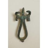 A Luristan bronze pendant with twin ibex head decoration, 3" long