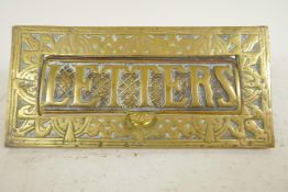 A vintage brass letterbox with Art Nouveau design and marked letters, 9¾" x 4¾"