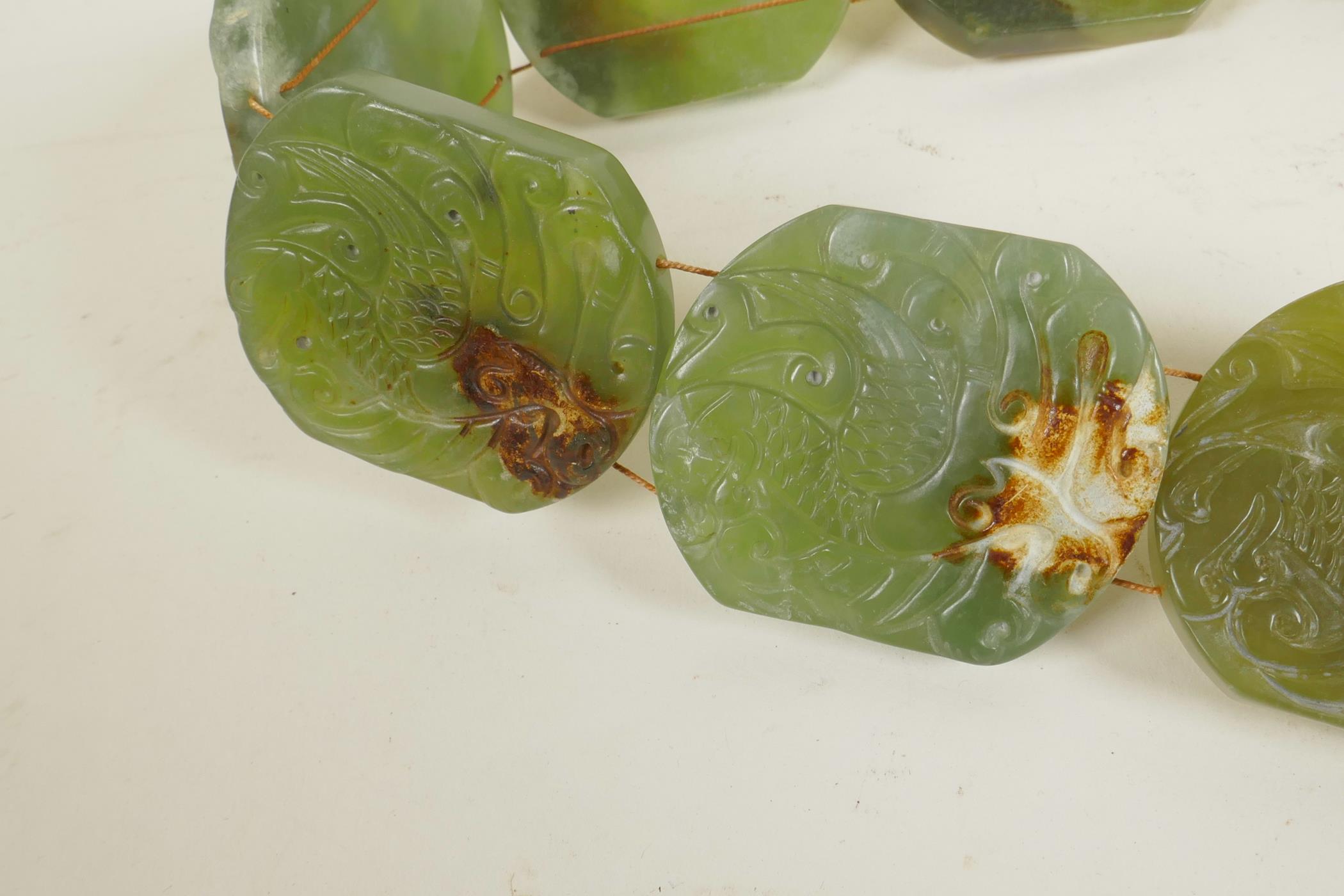 A Chinese green jade belt, with carved decoration to each panel depicting a phoenix, 40" long - Image 4 of 4