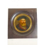 A circular miniature painting on papier mache, possibly Stobwasser, of the Portuguese explorer