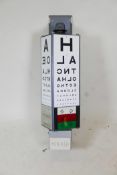 A backlit revolving optician's board for wall mounting, by Clement Clarke International Ltd, 39"