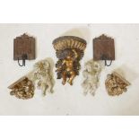 A collection of gilt composition and carved wood wall brackets decorated with putti, largest 12"