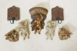 A collection of gilt composition and carved wood wall brackets decorated with putti, largest 12"