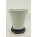 A Chinese celadon glazed porcelain vase of flared shape with embossed leaf decoration, 7¾" high,