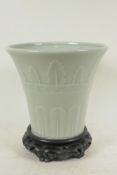 A Chinese celadon glazed porcelain vase of flared shape with embossed leaf decoration, 7¾" high,