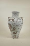 A Chinese Ming style red and white porcelain vase with two mask handles and dragon decoration, 13"