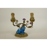 An unusual two branch ormolu lamp with scrolling vine, porcelain flowers and kylin decoration, 8½"
