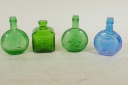 Four green and blue glass chemist bottles, 3" high, three embossed with portraits of American